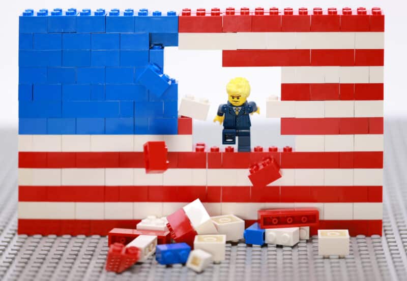 Lego Donald Trump Destroying the American Flag. A Metaphor for his lack of transparent communication.